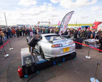 car on mobile dyno at a car show