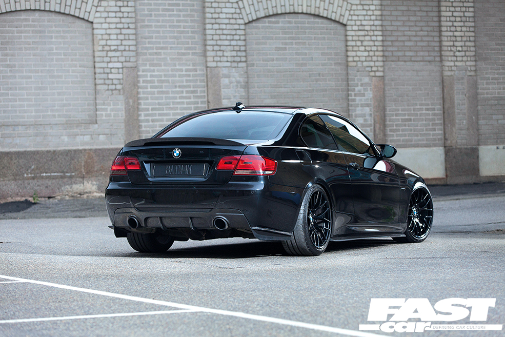rear 3/4 shot of black 335i BMW