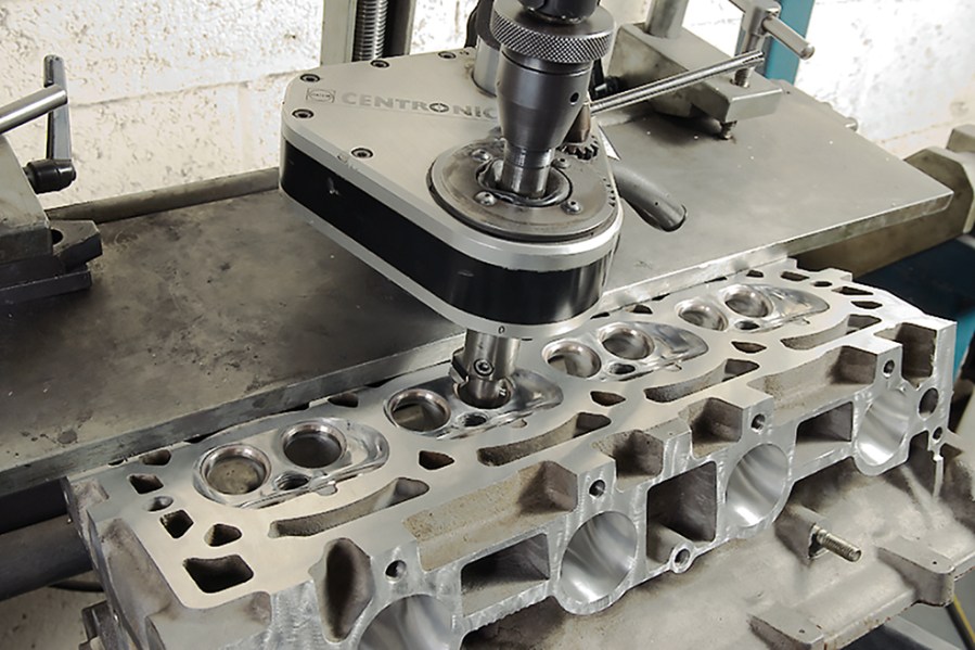Close up shot of valve seats of a silver cylinder head
