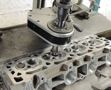 Close up shot of valve seats of a silver cylinder head