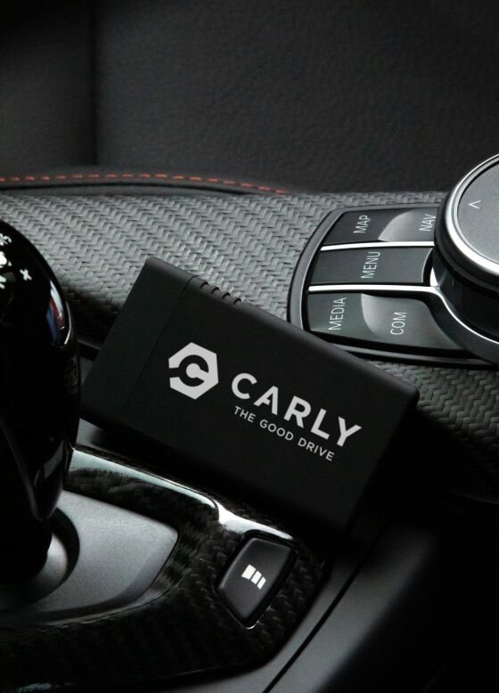 Carly connector positioned next to gear lever in a car
