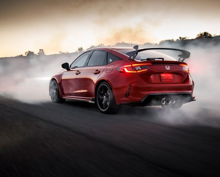 An FL5 Civic surrounded by tire smoke.