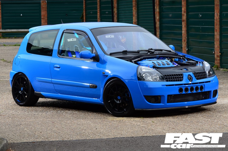 The right side of a blue Renault Clio 182 with no bonnet