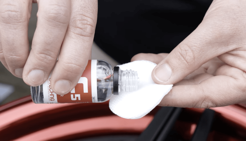 Pouring C5 Wheel Armour onto an applicator pad